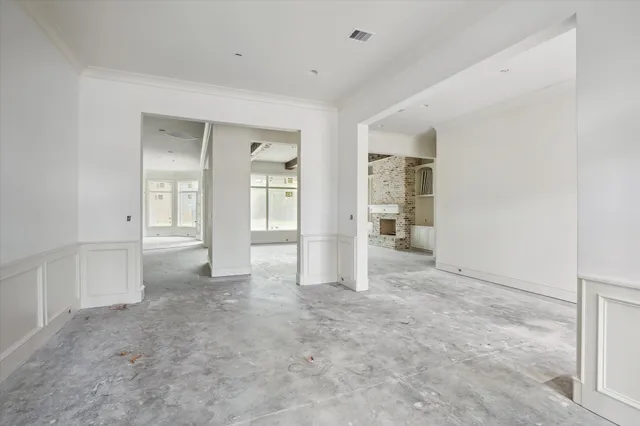 an empty room with closet and a bathroom