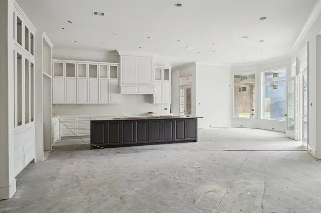 a view of kitchen with stainless steel appliances granite countertop a stove and a refrigerator
