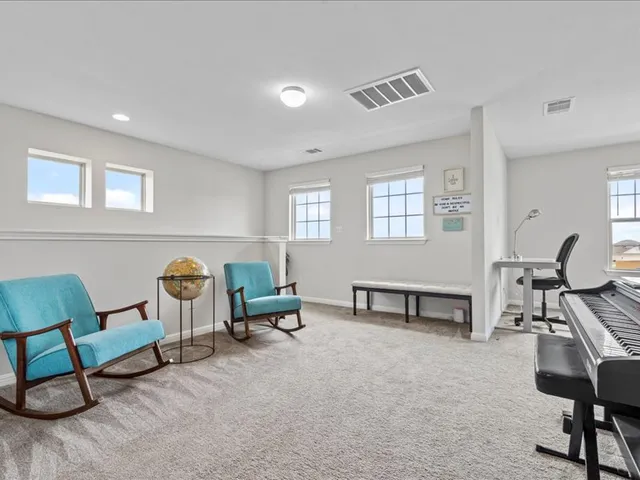 a bedroom with bed and a window