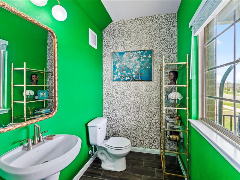 8201 Daisy Cutter Crossing Georgetown, TX 78626 - Photo 19 of 31 Half bathroom with healthy amount of natural light and wood finish floors
