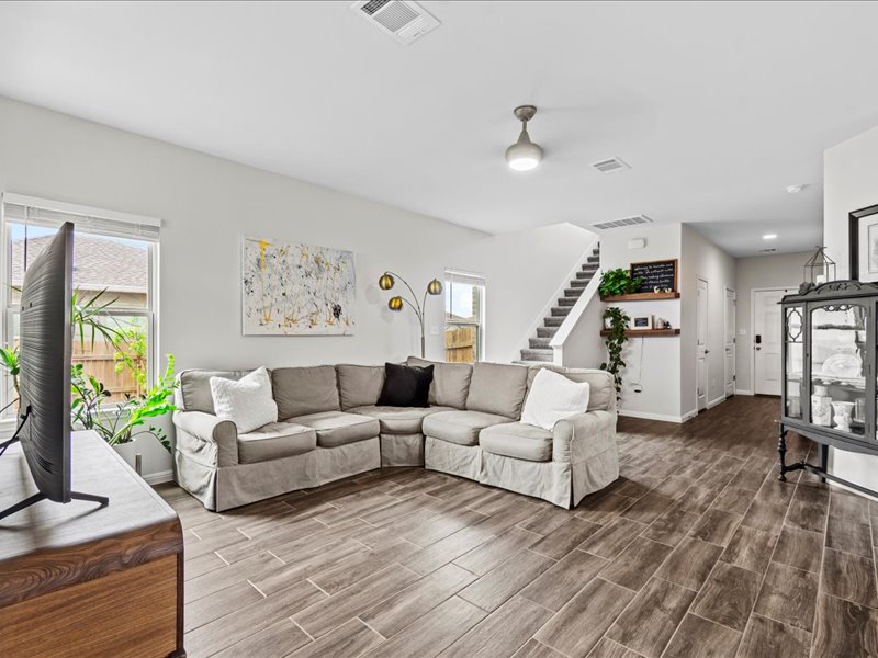 8201 Daisy Cutter Crossing Georgetown, TX 78626 - Photo 5 of 31 Living room with stairway and wood tiled floors