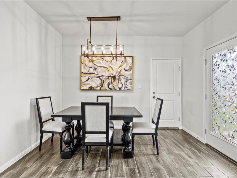 8201 Daisy Cutter Crossing Georgetown, TX 78626 - Photo 6 of 31 Dining space with wood tiled floors