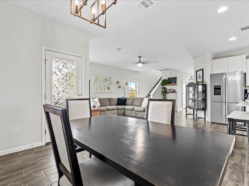 8201 Daisy Cutter Crossing Georgetown, TX 78626 - Photo 7 of 31 Dining area featuring wood finish floors, stairway, and recessed lighting