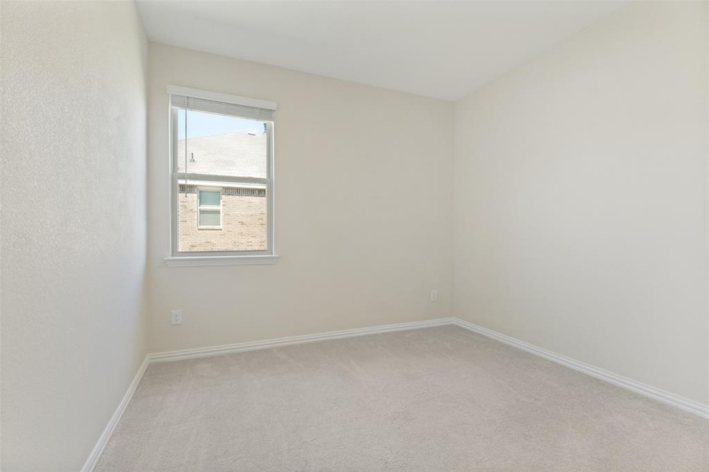 1237 Almond Road Azle, TX 76020 - Photo 18 of 24 an empty room with a window
