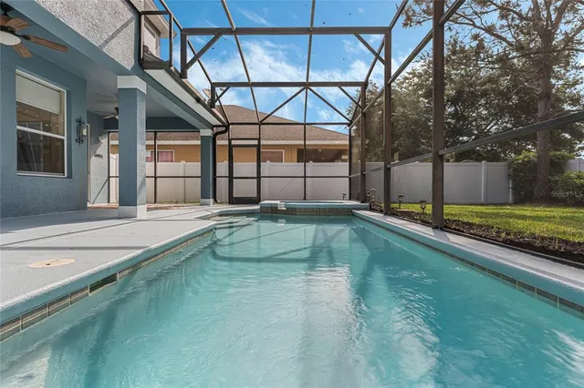 a view of a house with a backyard