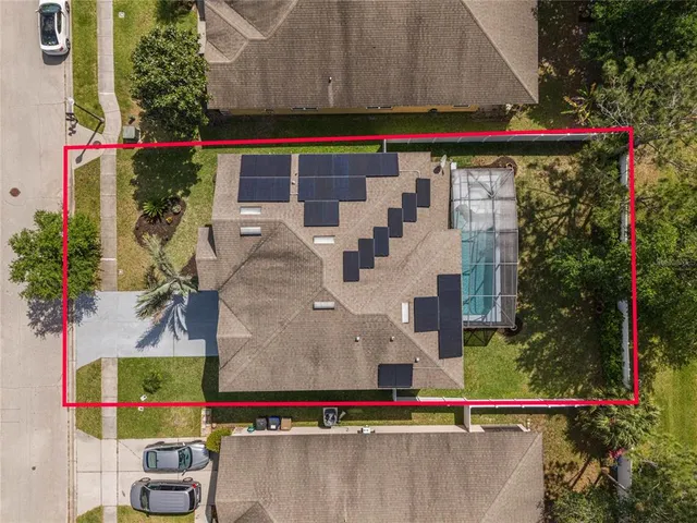 an aerial view of residential building and lake