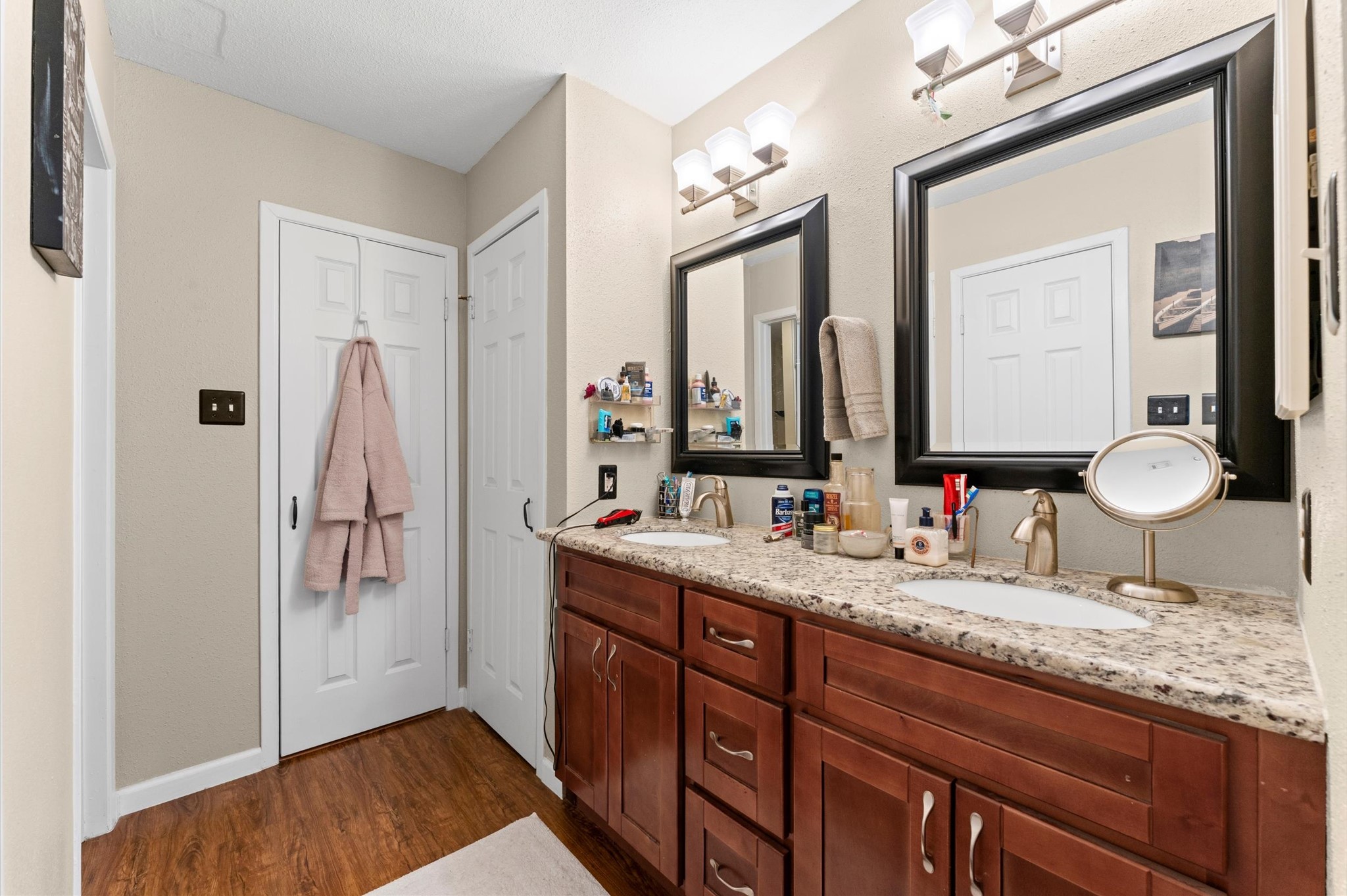 1504 Early Lane Houston, TX 77055 - Photo 11 of 23 a bathroom with a granite countertop sink vanity and mirror