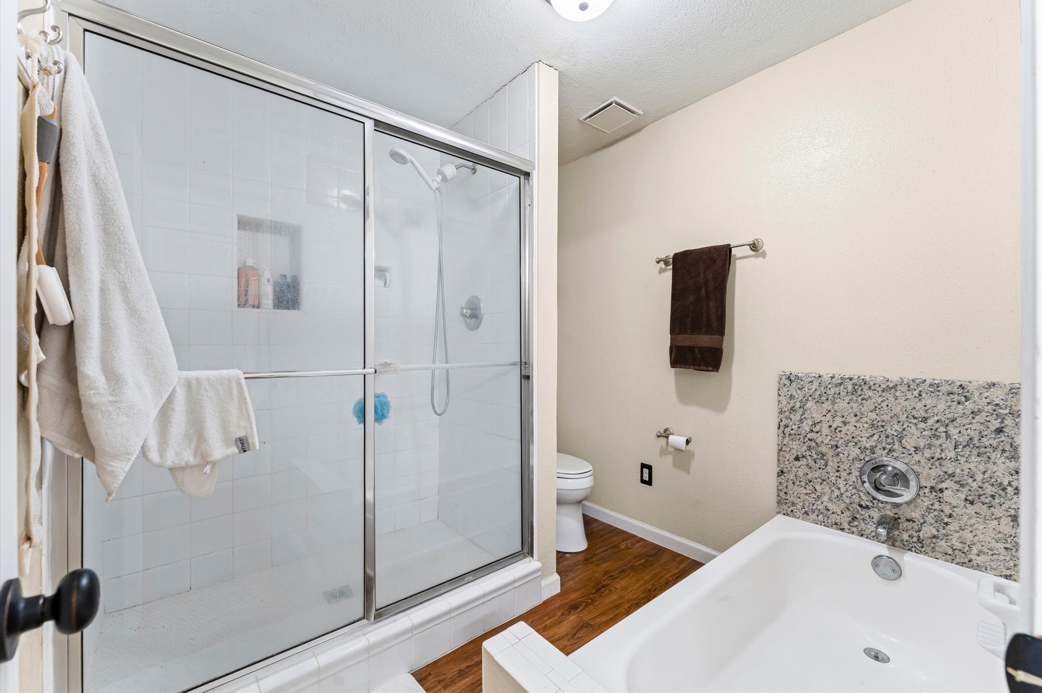 1504 Early Lane Houston, TX 77055 - Photo 12 of 23 a bathroom with a bathtub and a shower