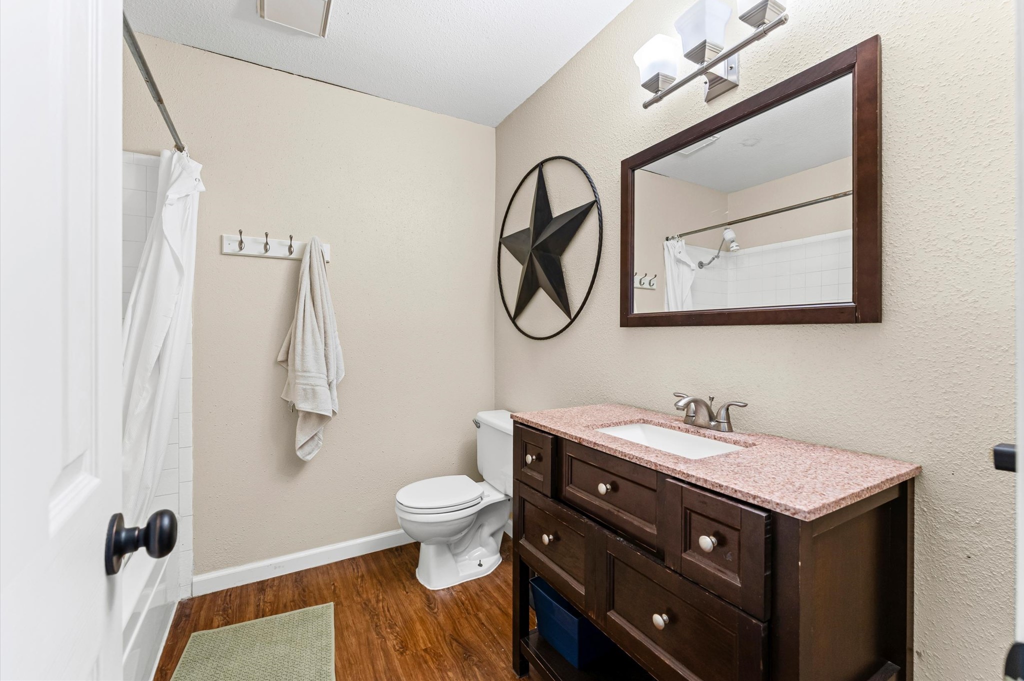 1504 Early Lane Houston, TX 77055 - Photo 13 of 23 a bathroom with a sink and a mirror
