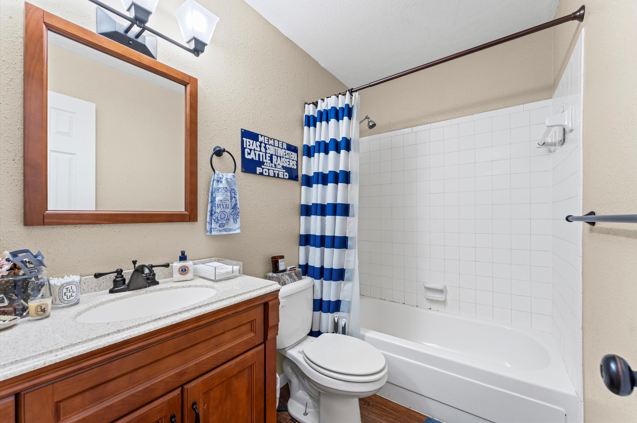 1504 Early Lane Houston, TX 77055 - Photo 7 of 23 a bathroom with a sink a toilet and shower