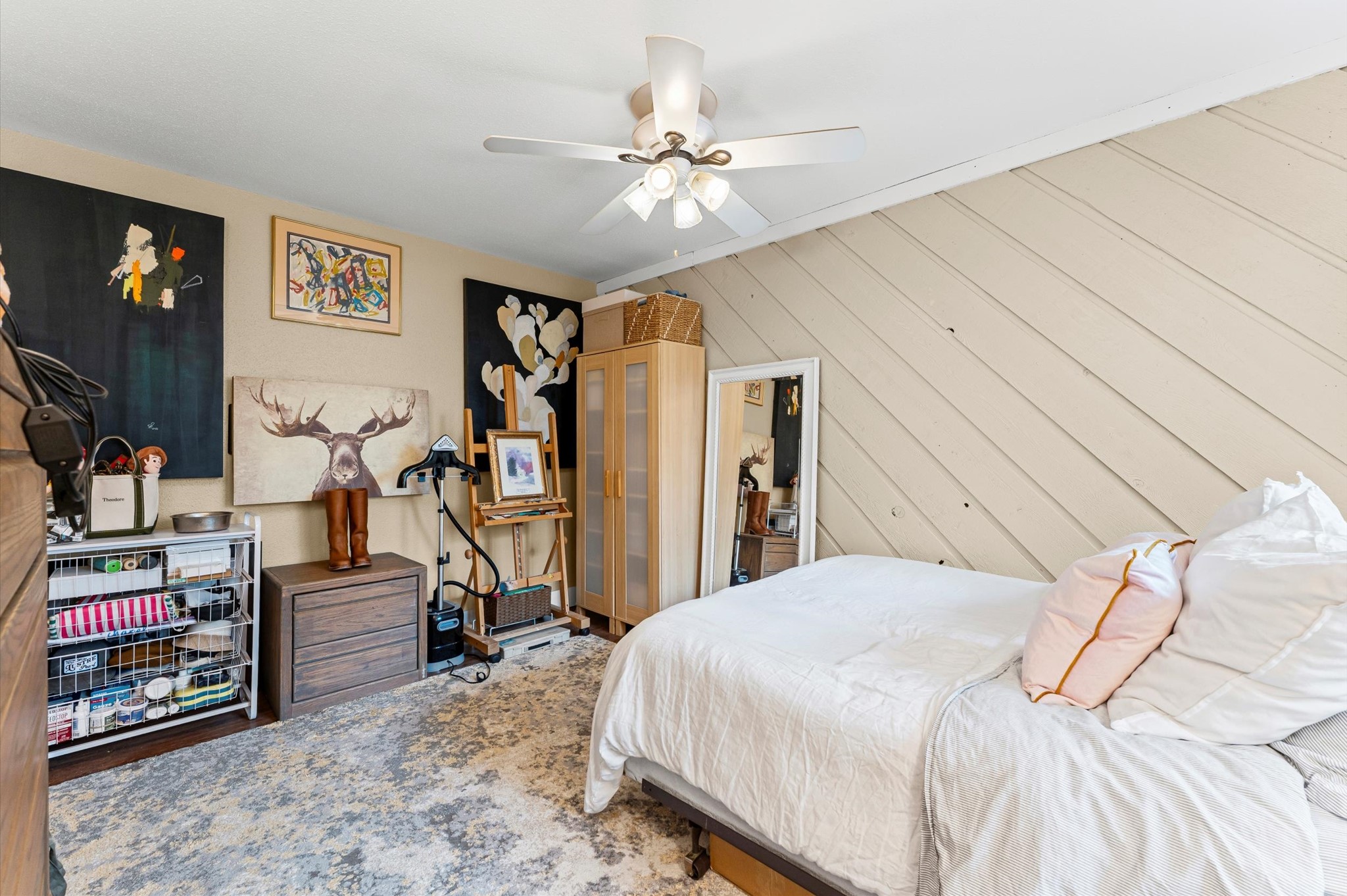 1504 Early Lane Houston, TX 77055 - Photo 8 of 23 a bedroom with a bed and a chandelier