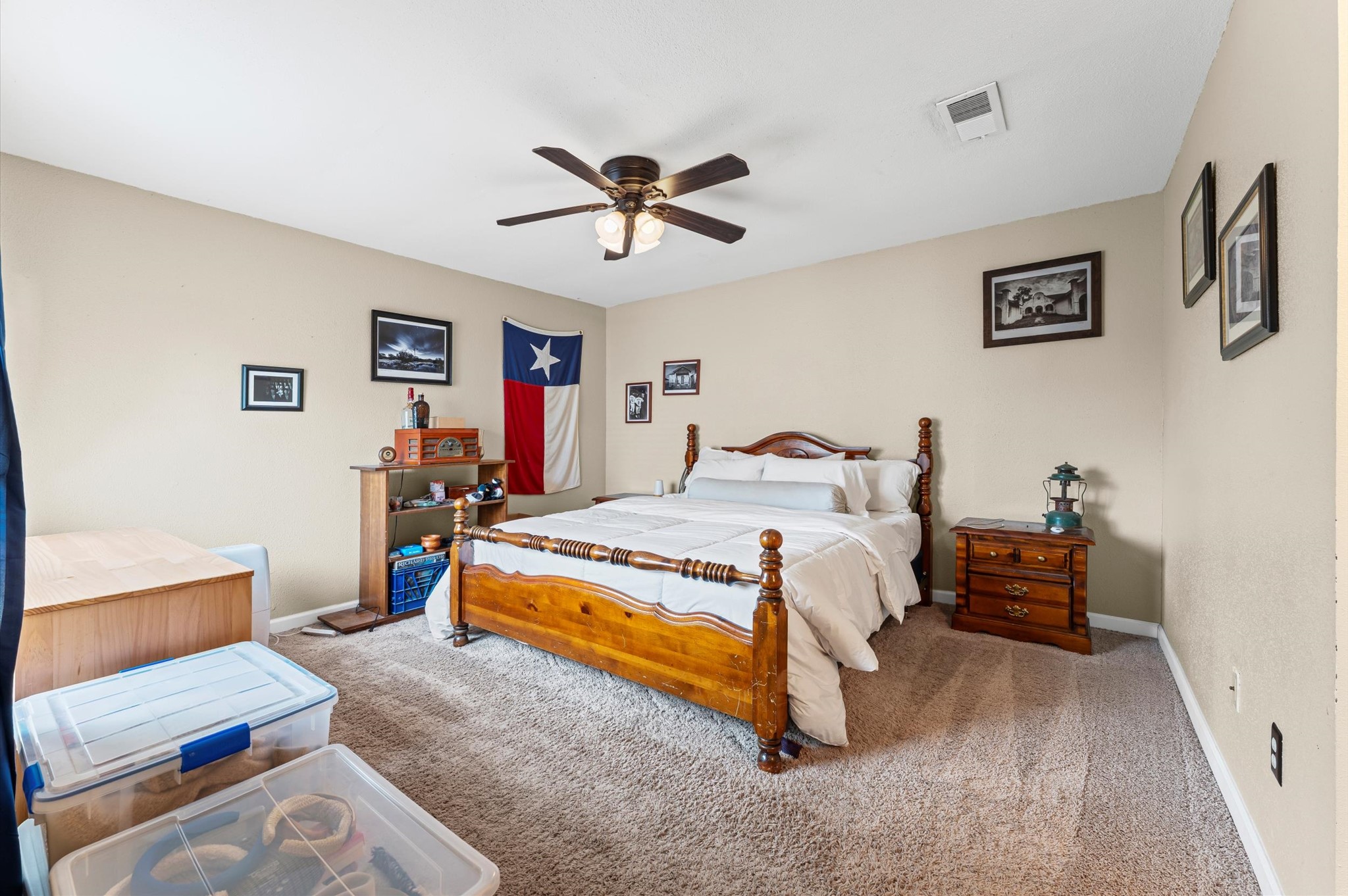 1504 Early Lane Houston, TX 77055 - Photo 10 of 23 a bedroom with a bed and a chandelier