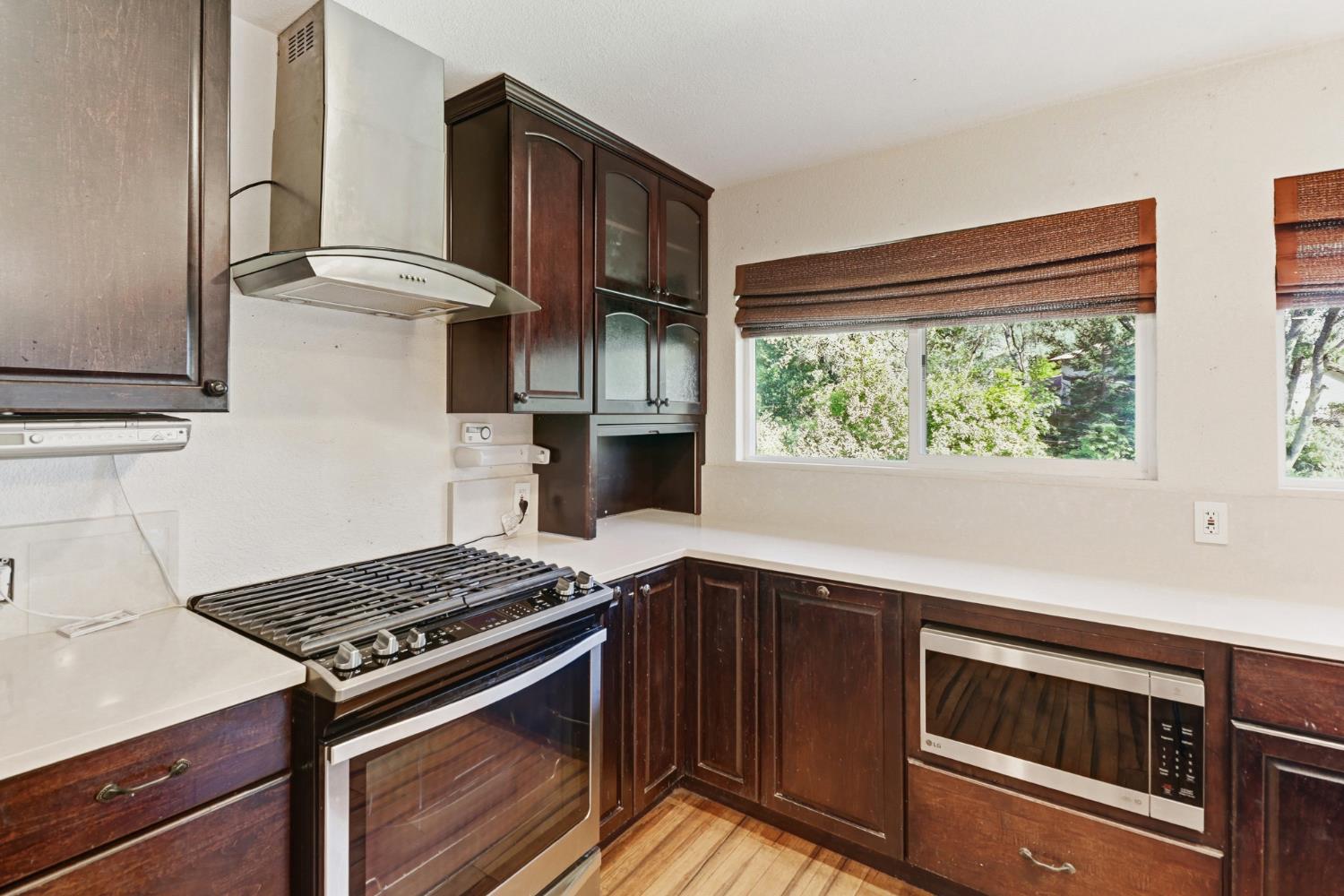 4330 Cavitt Stallman Road Granite Bay, CA 95746 - Photo 27 of 85 a kitchen with stainless steel appliances a stove and a refrigerator