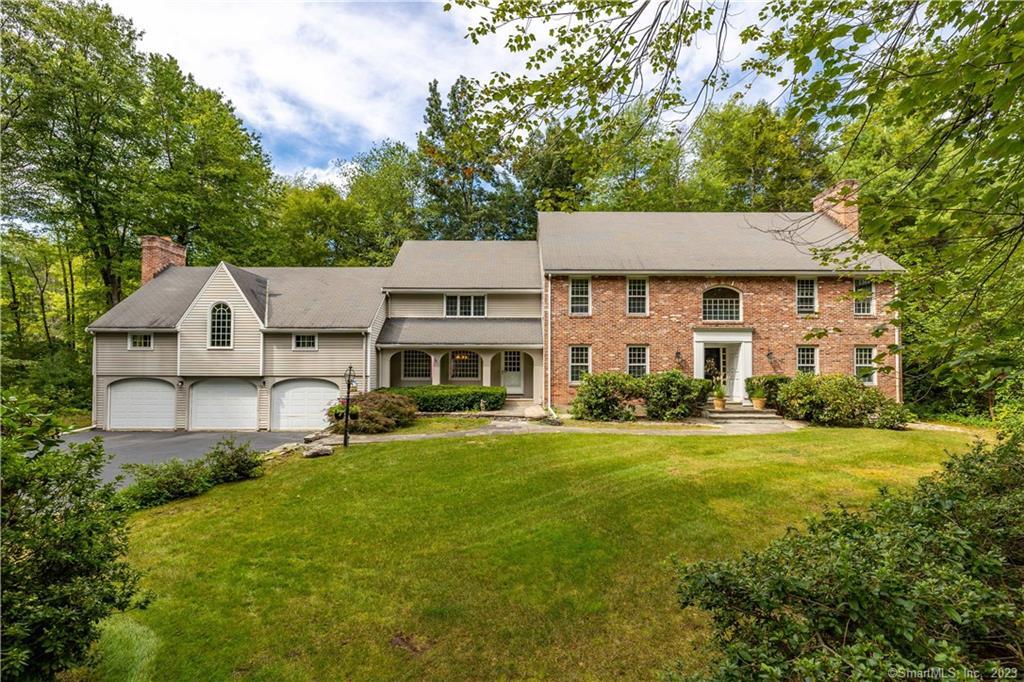 Beautiful Brick Colonial located at the end of the cul-de-sac on a private, level lot