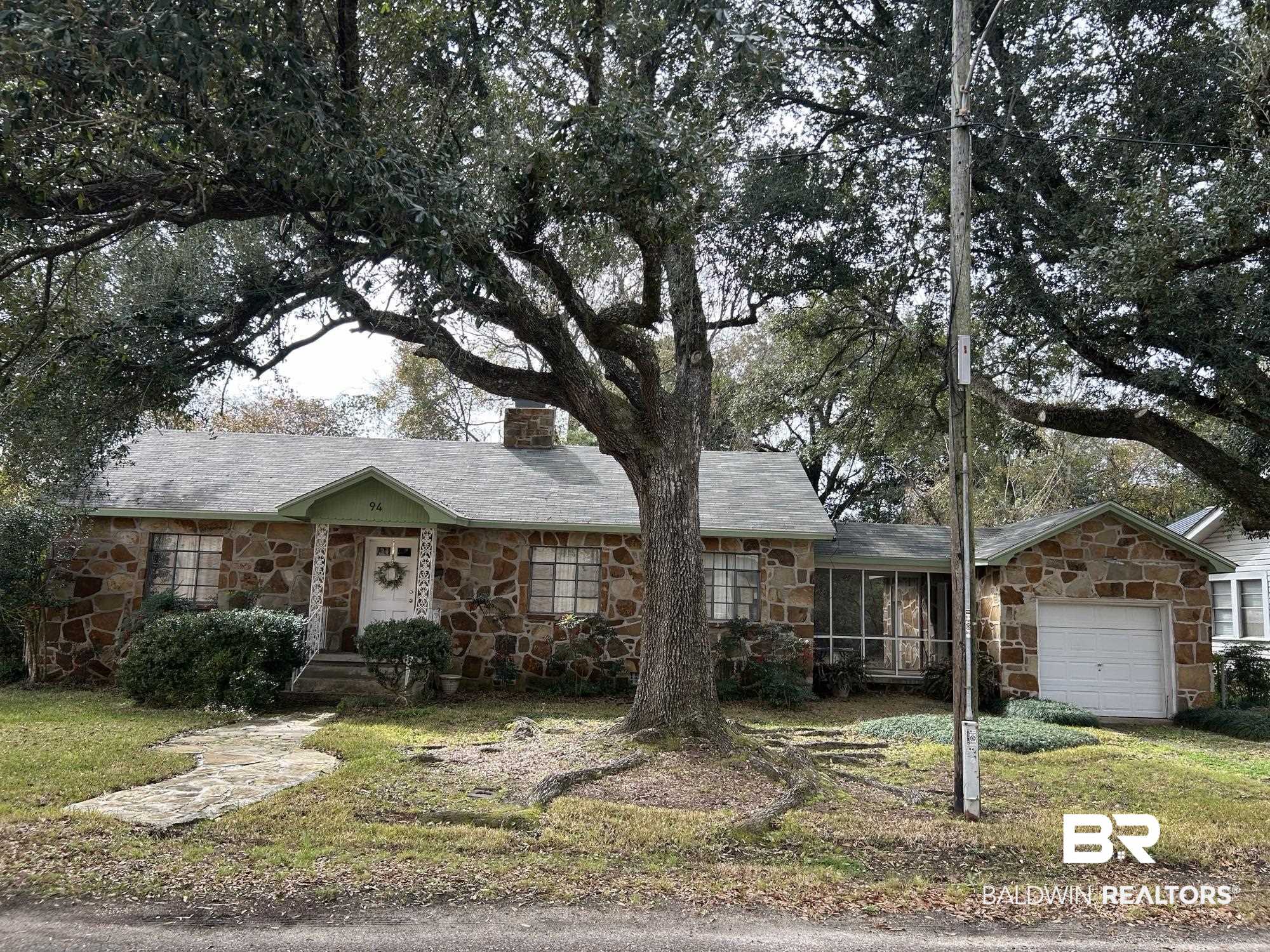94 Diamond Street Mobile, AL 36611 - Photo 1 of 30 Ranch-style house with a garage, a sunroom, and a front yard