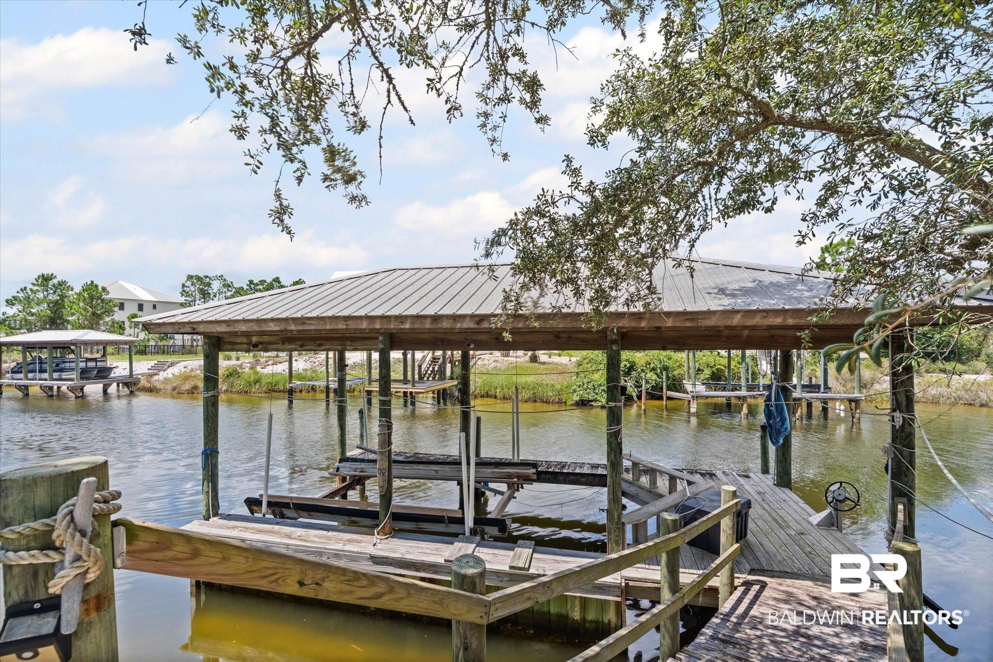 33129 River Road Orange Beach, AL 36561 - Photo 20 of 34 Dock featuring a water view and boat lift