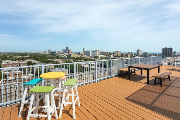 a view of a chairs on wooden deck