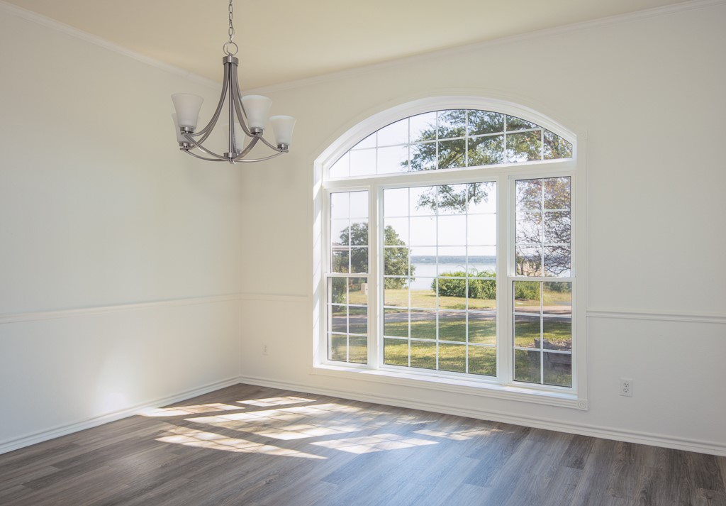 4488 Blue Ridge Drive Belton, TX 76513 - Photo 14 of 35 a view of an empty room with wooden floor and a window