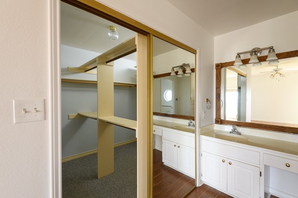 4488 Blue Ridge Drive Belton, TX 76513 - Photo 19 of 35 a bathroom with a double vanity sink and mirror