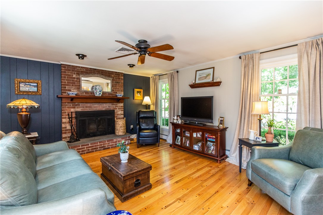 65 Thunder Trail Cranston, RI 02921 - Photo 15 of 49 Family room with brick fireplace