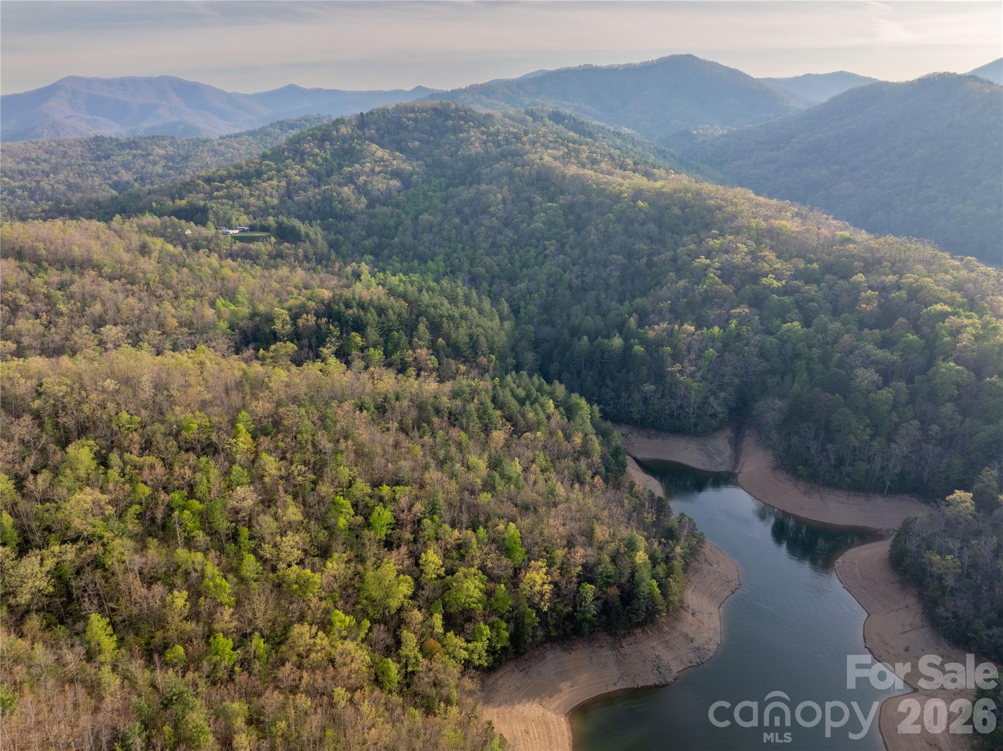 8888 Yellow Branch Road Robbinsville, NC 28771 - Photo 27 of 28 a view of a mountain with a yard