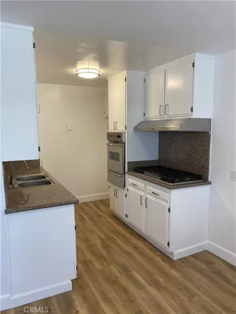 a kitchen with a stove and a microwave