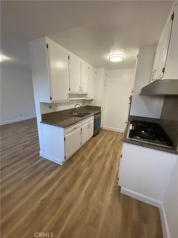 a kitchen with stainless steel appliances granite countertop a stove and a sink