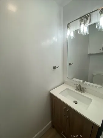 a bathroom with a sink and mirror