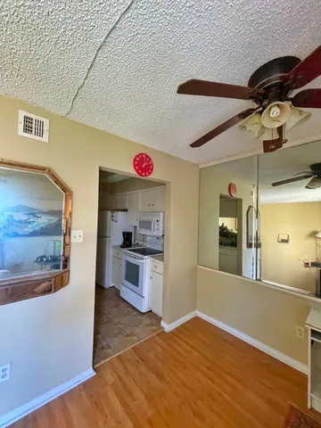 a kitchen with a refrigerator and a stove
