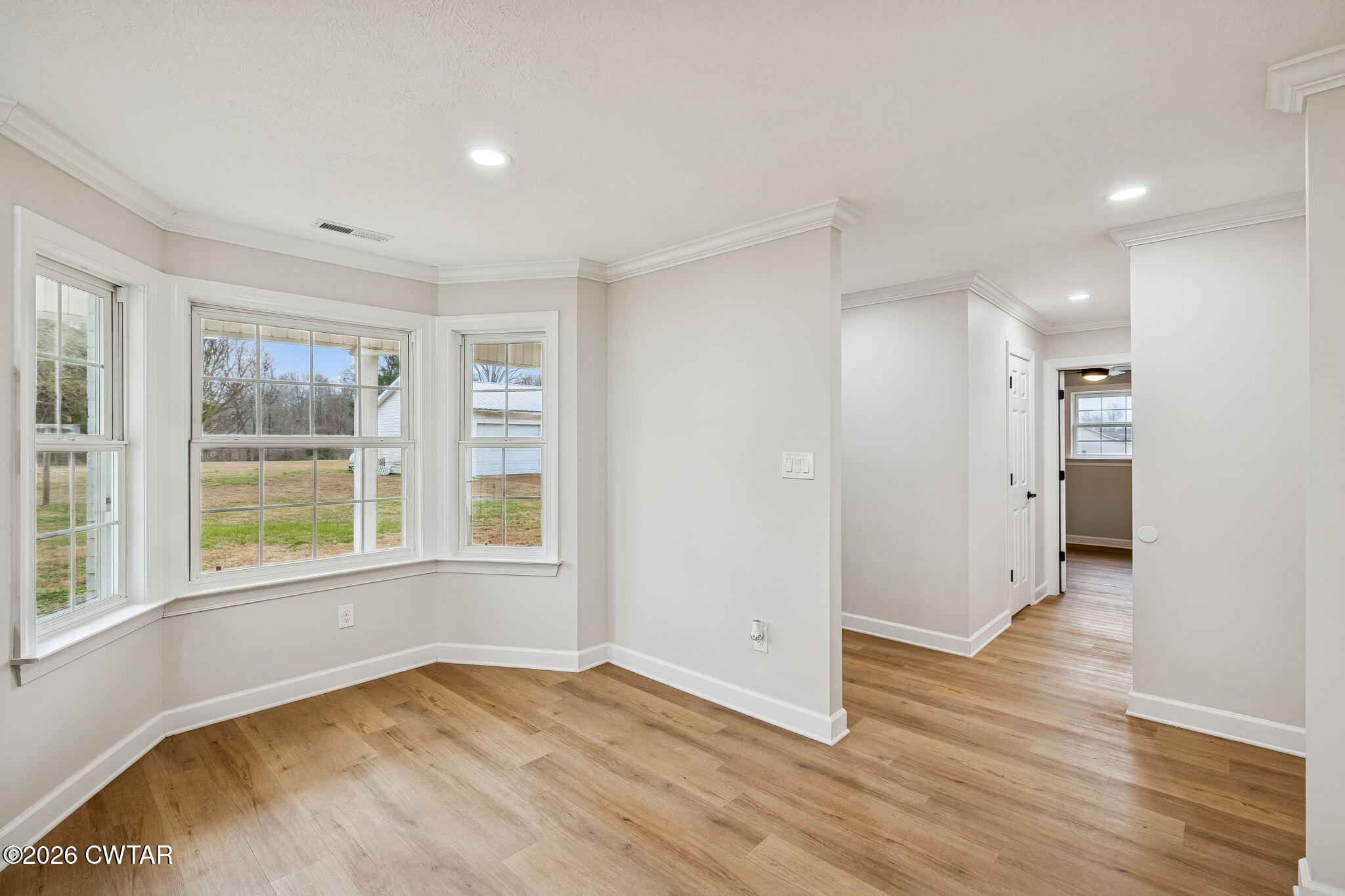 123 Walnut Hill Road Bells, TN 38006 - Photo 26 of 61 a view of an empty room with wooden floor and a window