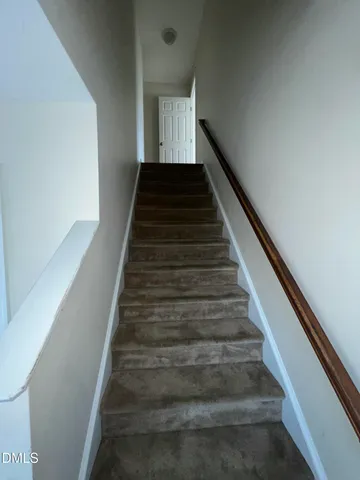 a bathroom with a double vanity sink toilet and shower