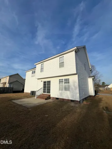 a view of house with yard