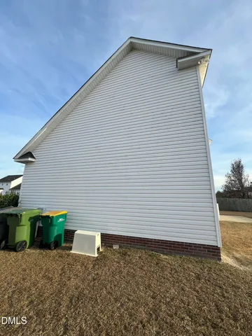 a view of an entryway with wooden floor and door