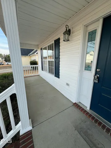 a view of an empty room with a fireplace