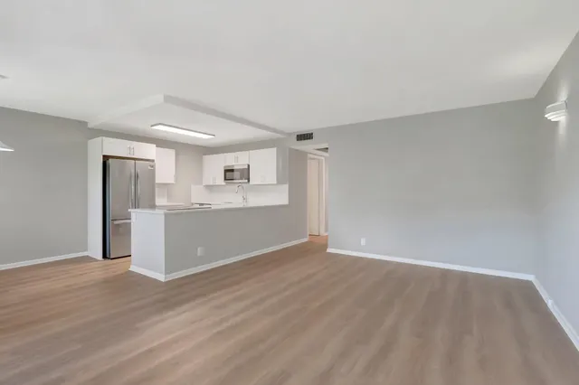 a view of kitchen with wooden floor