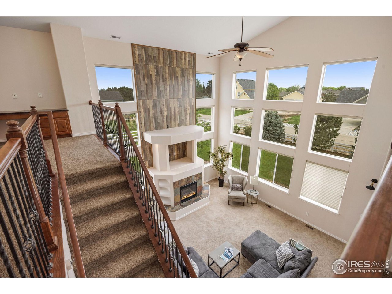 3427 Red Hawk Lane Longmont, CO 80504 - Photo 12 of 33 a living room with furniture and a fireplace