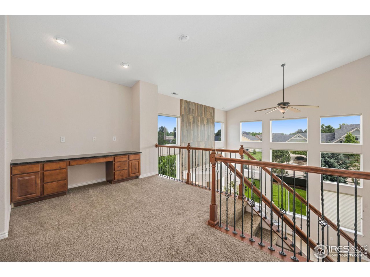 3427 Red Hawk Lane Longmont, CO 80504 - Photo 13 of 33 a view of a kitchen with furniture and a window
