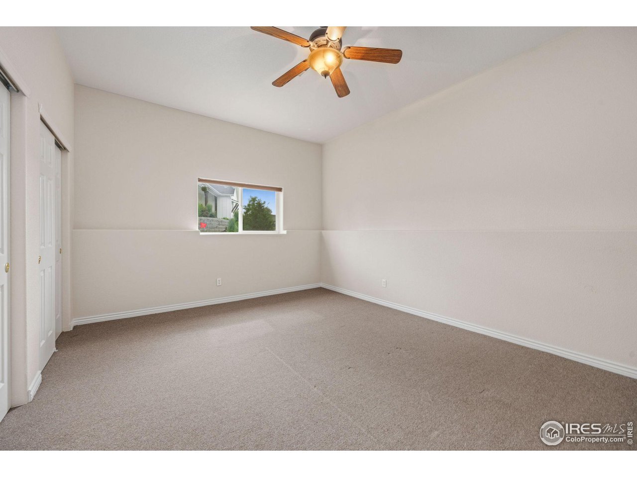 3427 Red Hawk Lane Longmont, CO 80504 - Photo 22 of 33 a view of a big room with carpet