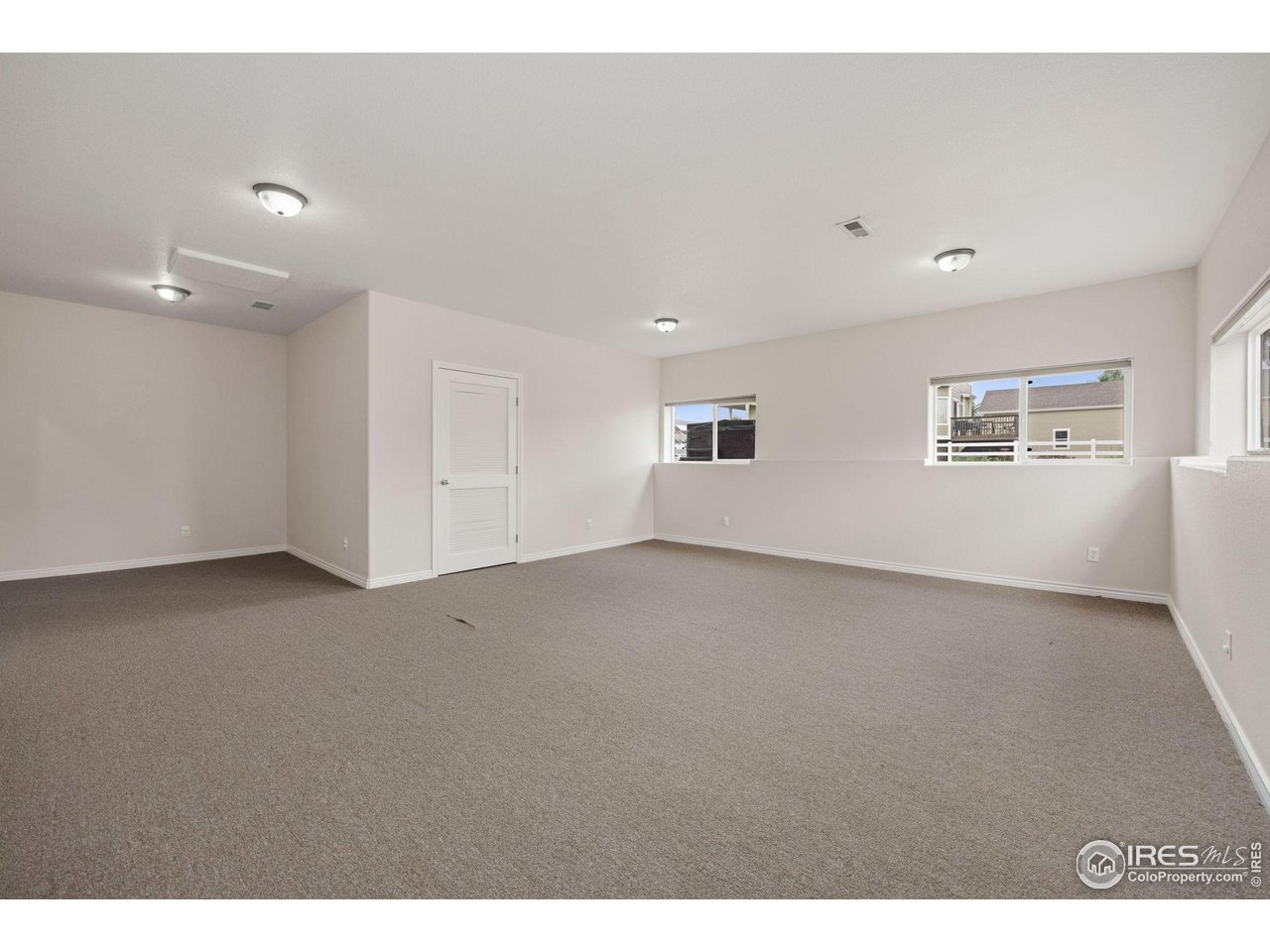 3427 Red Hawk Lane Longmont, CO 80504 - Photo 25 of 33 a view of an empty room with a window