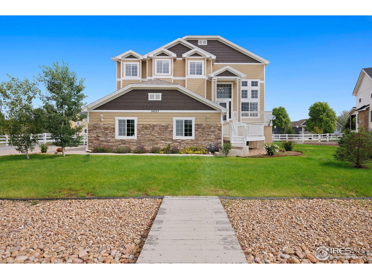 3427 Red Hawk Lane Longmont, CO 80504 - Photo 28 of 33 a front view of a house with a yard