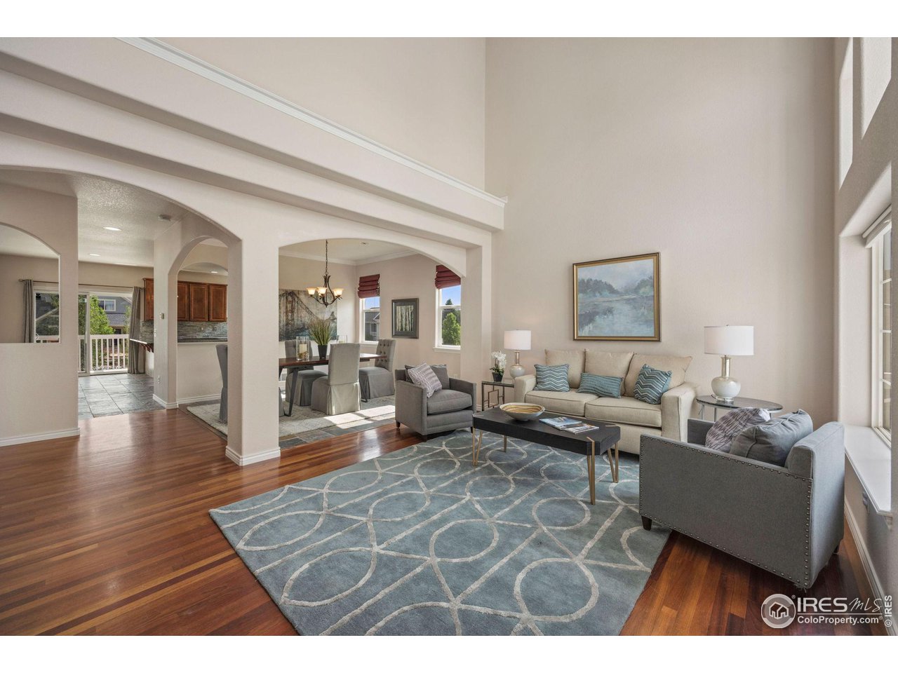 3427 Red Hawk Lane Longmont, CO 80504 - Photo 3 of 33 a living room with furniture and a wooden floor