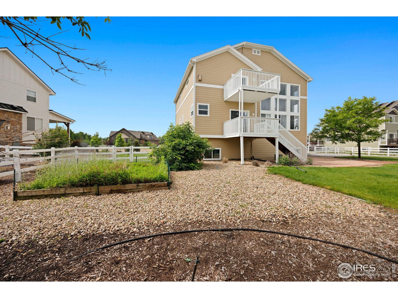 3427 Red Hawk Lane Longmont, CO 80504 - Photo 31 of 33 a front view of a house with a yard