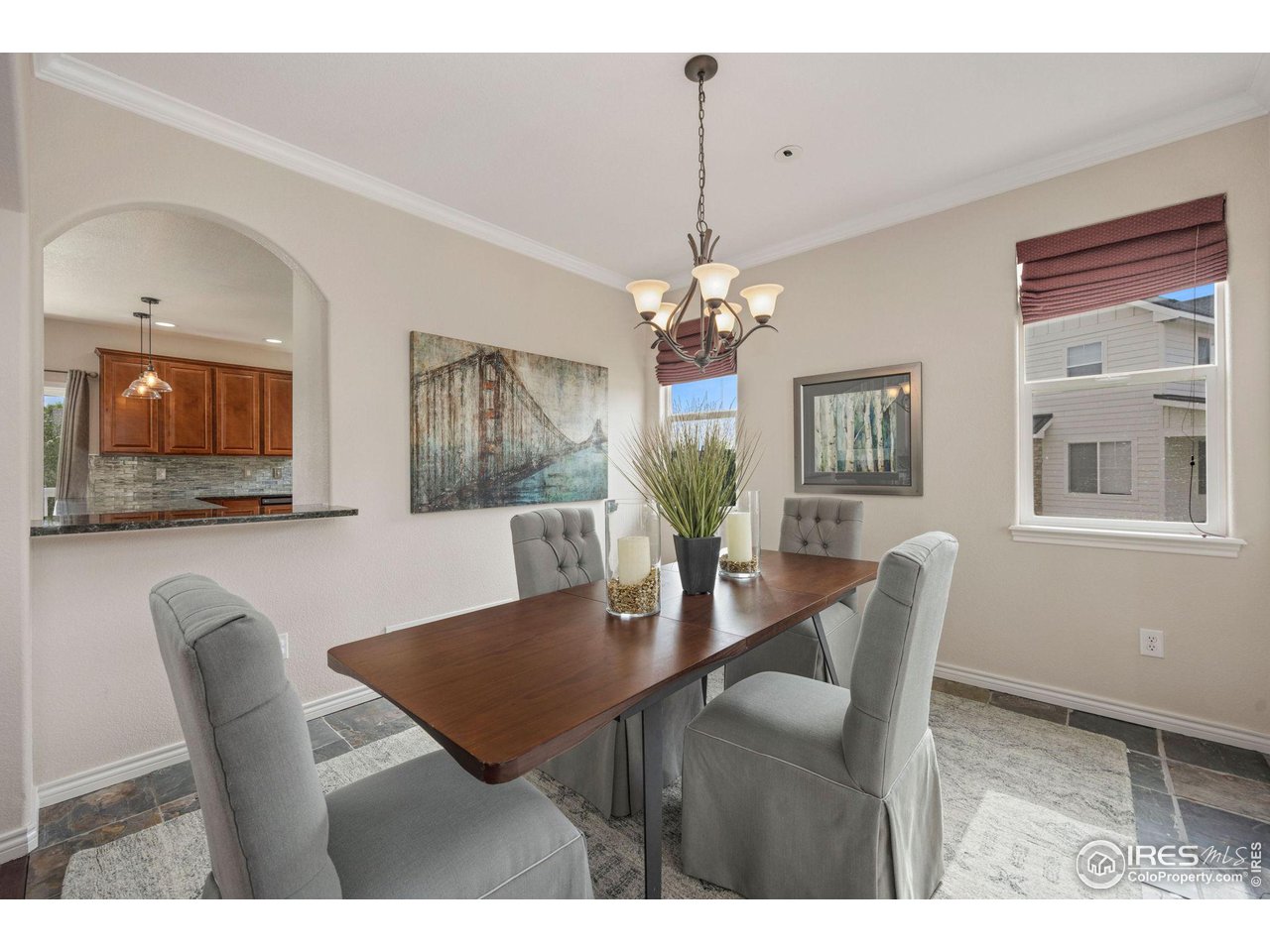 3427 Red Hawk Lane Longmont, CO 80504 - Photo 4 of 33 a view of a dining room with furniture and chandelier