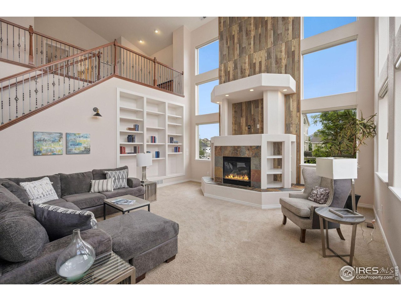 3427 Red Hawk Lane Longmont, CO 80504 - Photo 9 of 33 a living room with furniture and a fireplace