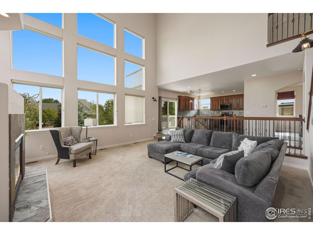 3427 Red Hawk Lane Longmont, CO 80504 - Photo 10 of 33 a living room with furniture and a large window