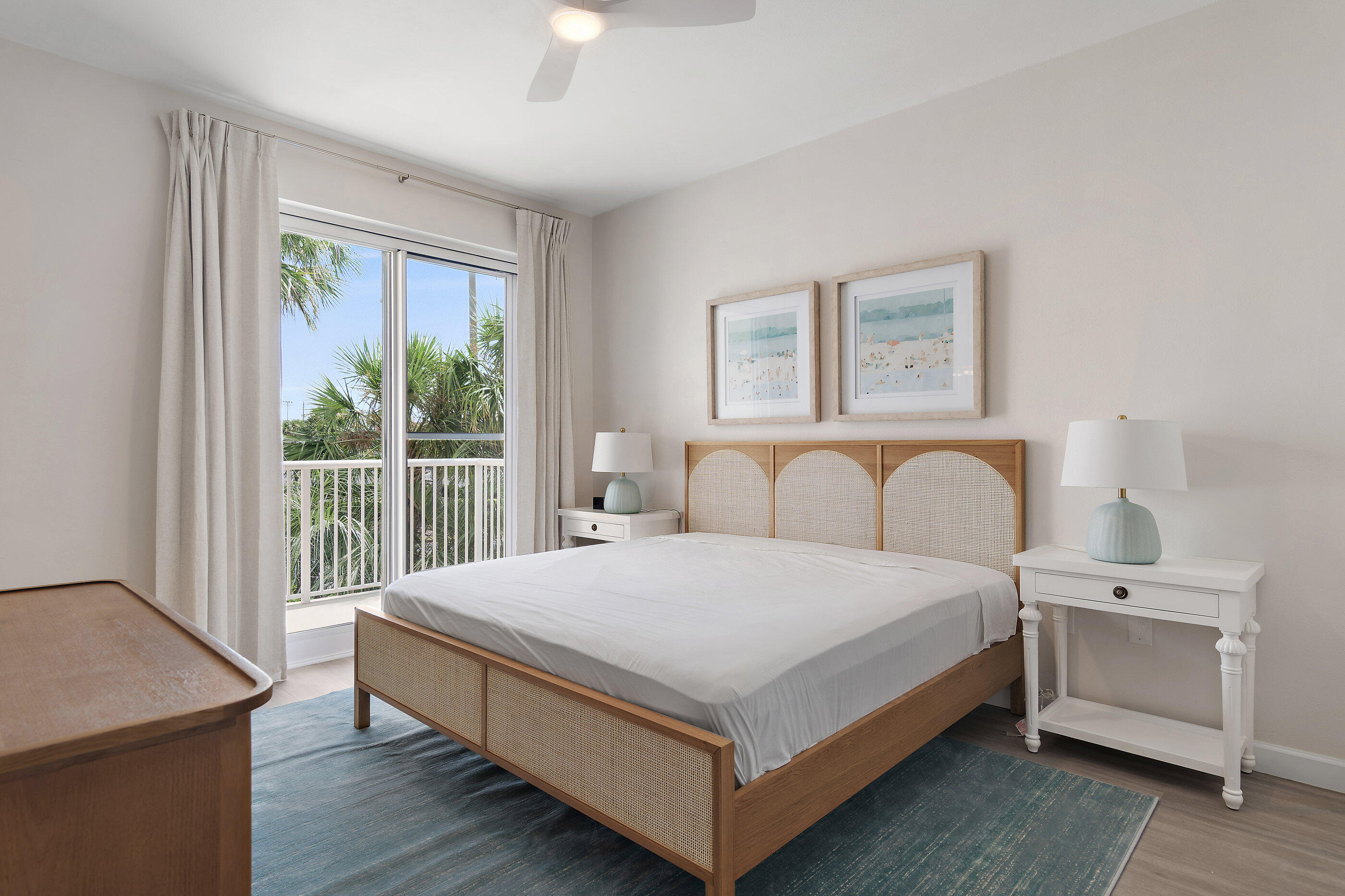 970 Highway 98, Unit 107 Destin, FL 32541 - Photo 23 of 28 a bedroom with a bed and a table