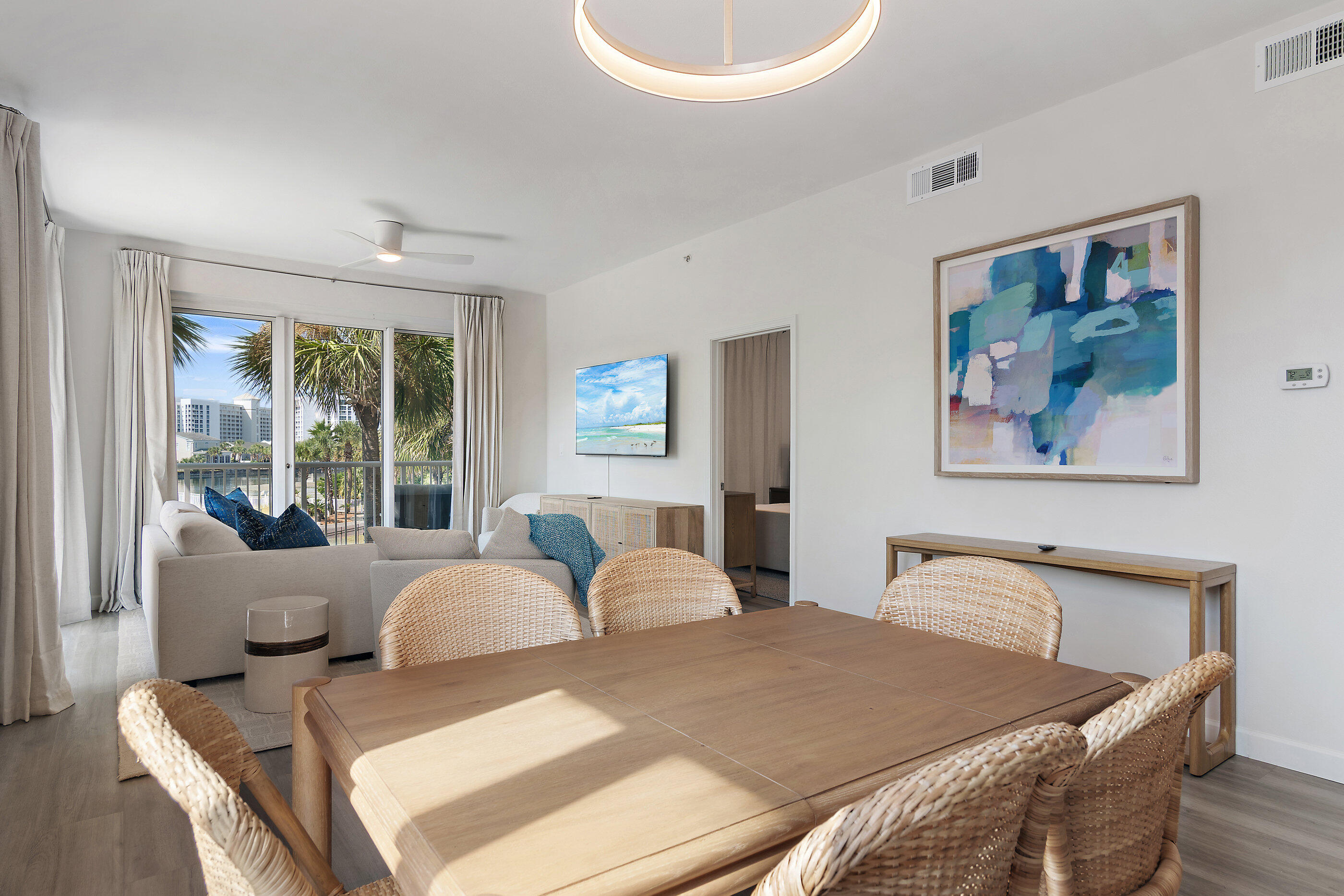 970 Highway 98, Unit 107 Destin, FL 32541 - Photo 8 of 28 a bedroom with furniture and a large window