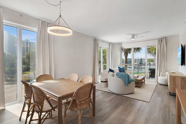 a view of a dining room with furniture wooden floor and a chandelier