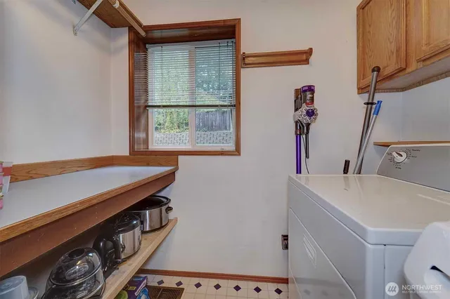 a kitchen with stainless steel appliances granite countertop wooden cabinets a stove top oven a sink and dishwasher