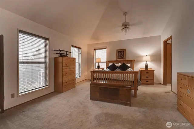 a bedroom with furniture and a window